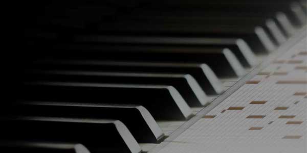 Close-up view of a piano when composition.