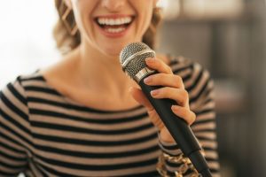 Girl Holding a Mic in Party