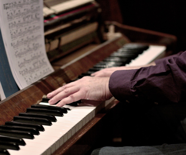 A Human Hand Playing Piano To Relieve Stress.